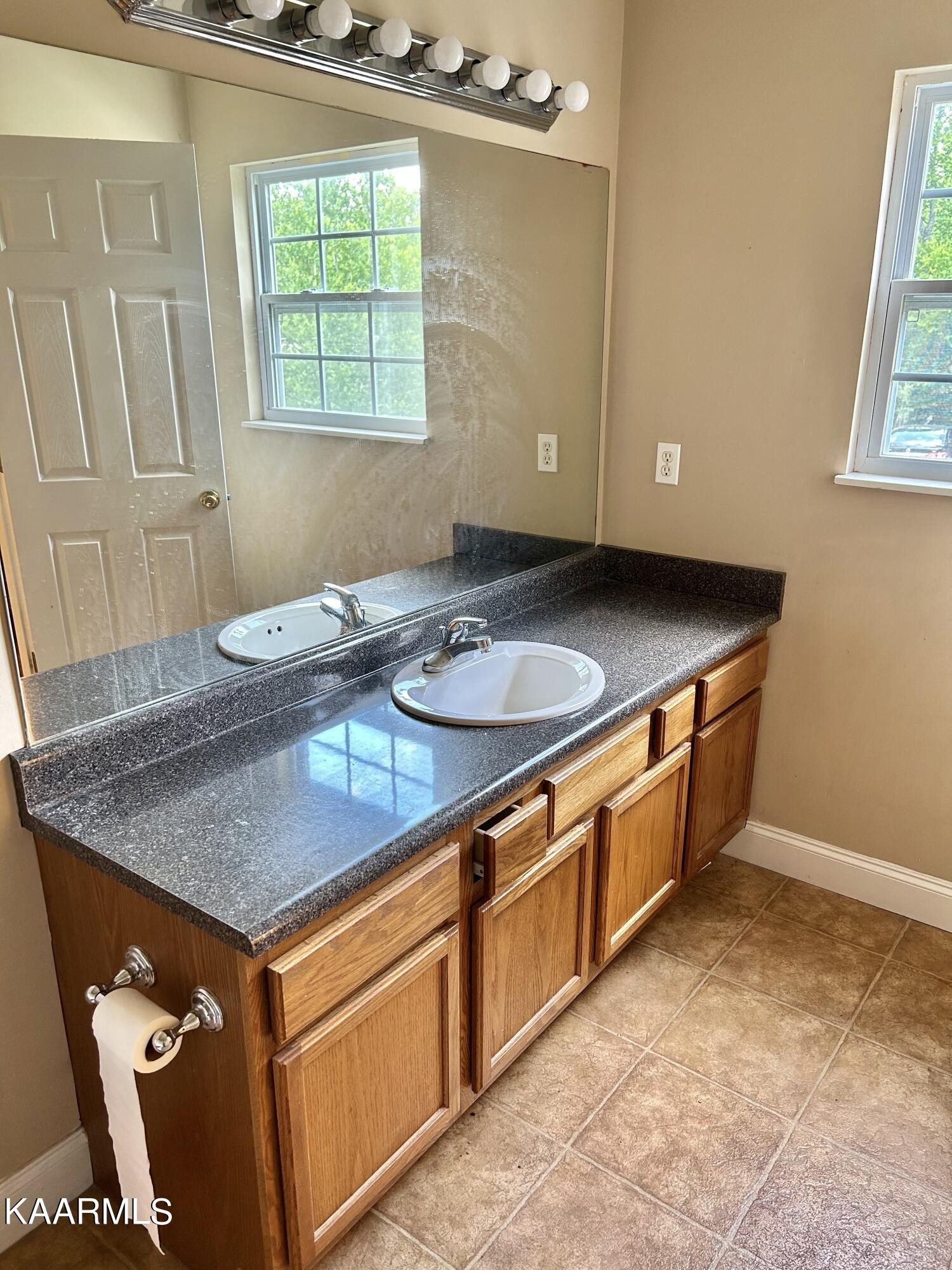 2309 Big Springs Road Maryville, TN 37801 - Photo 11 of 19 a kitchen with stainless steel appliances granite countertop a sink a stove cabinets and wooden floor