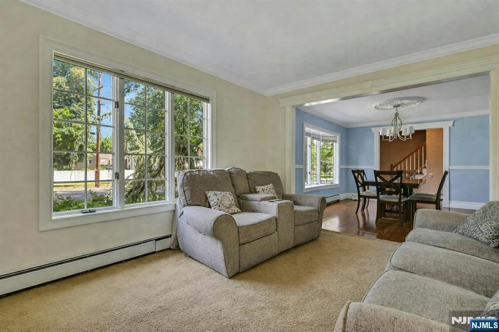 44 West Midland Avenue Paramus, NJ 07652 - Photo 7 of 19 a living room with furniture and a large window