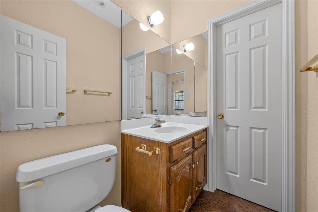 2510 Oak Ridge Clifton, TX 76634 - Photo 18 of 26 a bathroom with a sink a toilet and a mirror