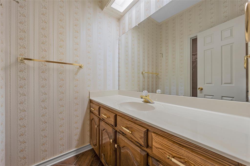 2510 Oak Ridge Clifton, TX 76634 - Photo 19 of 26 a bathroom with a sink and a mirror