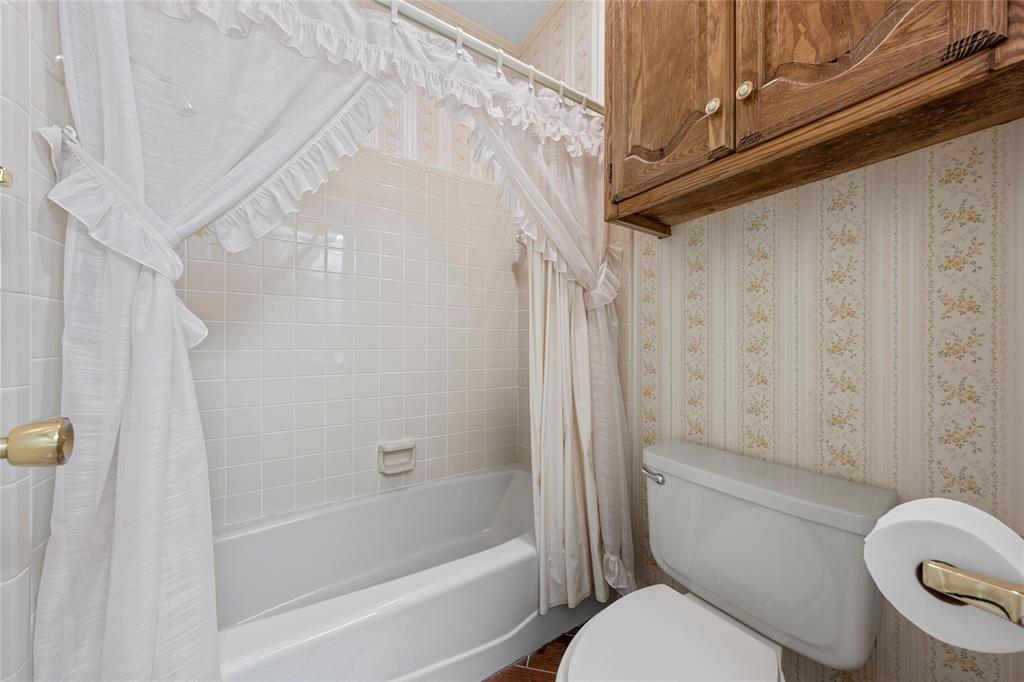 2510 Oak Ridge Clifton, TX 76634 - Photo 20 of 26 a bathroom with a toilet and a shower