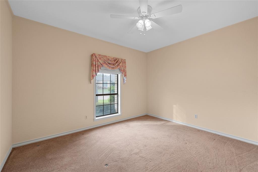 2510 Oak Ridge Clifton, TX 76634 - Photo 21 of 26 an empty room with a window and a fan