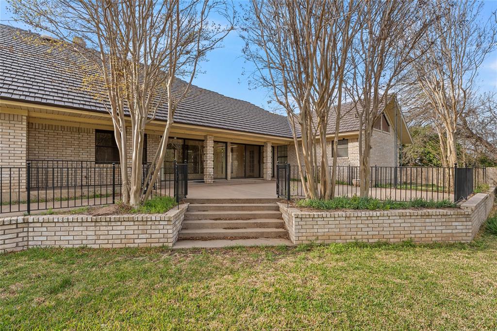 2510 Oak Ridge Clifton, TX 76634 - Photo 23 of 26 a view of a house with a small yard and wooden fence