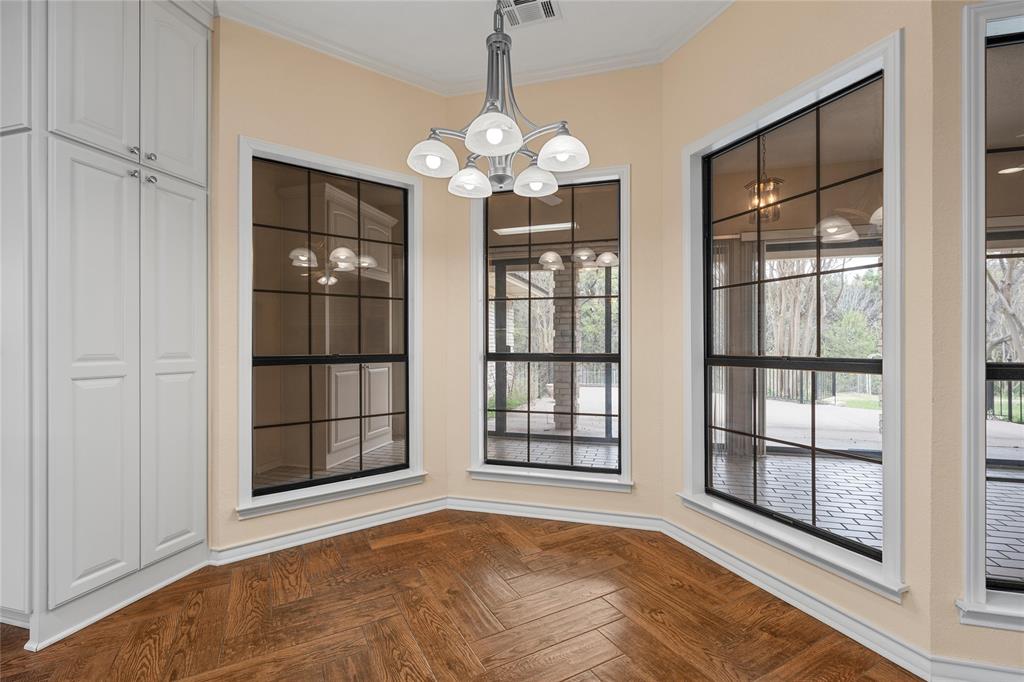 2510 Oak Ridge Clifton, TX 76634 - Photo 9 of 26 a view of an empty room with a window and chandelier fan