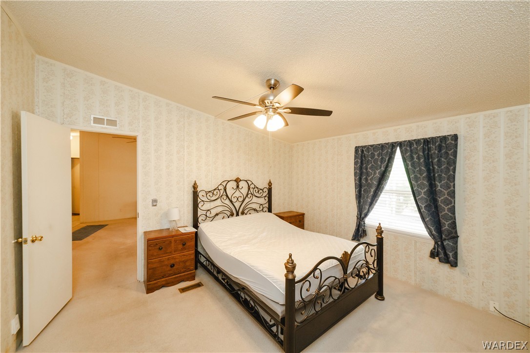 3003 Hualapai Mountain Road Kingman, AZ 86401 - Photo 17 of 49 a bedroom with a bed and window