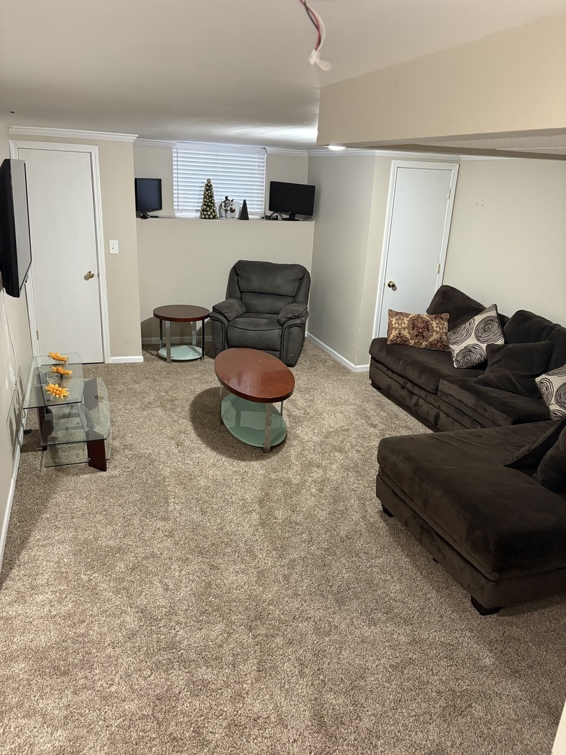 561 Sandy Court Harvard, IL 60033 - Photo 13 of 14 a living room with furniture and a flat screen tv