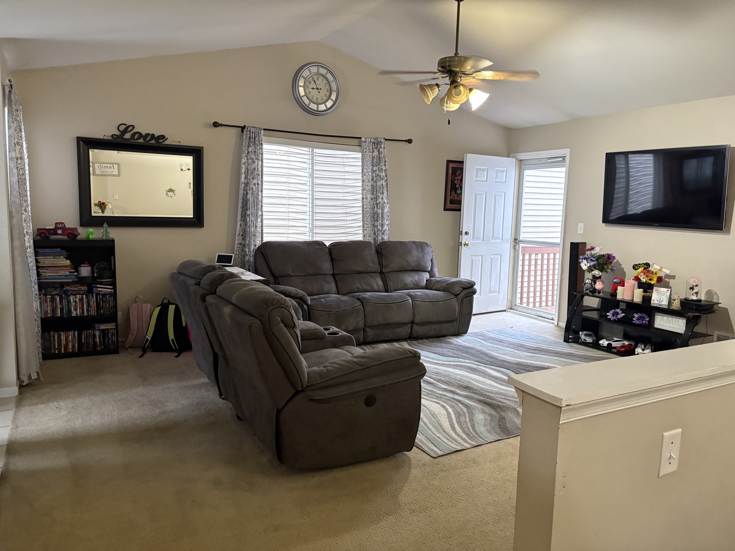 561 Sandy Court Harvard, IL 60033 - Photo 3 of 14 a living room with furniture a flat screen tv and a window