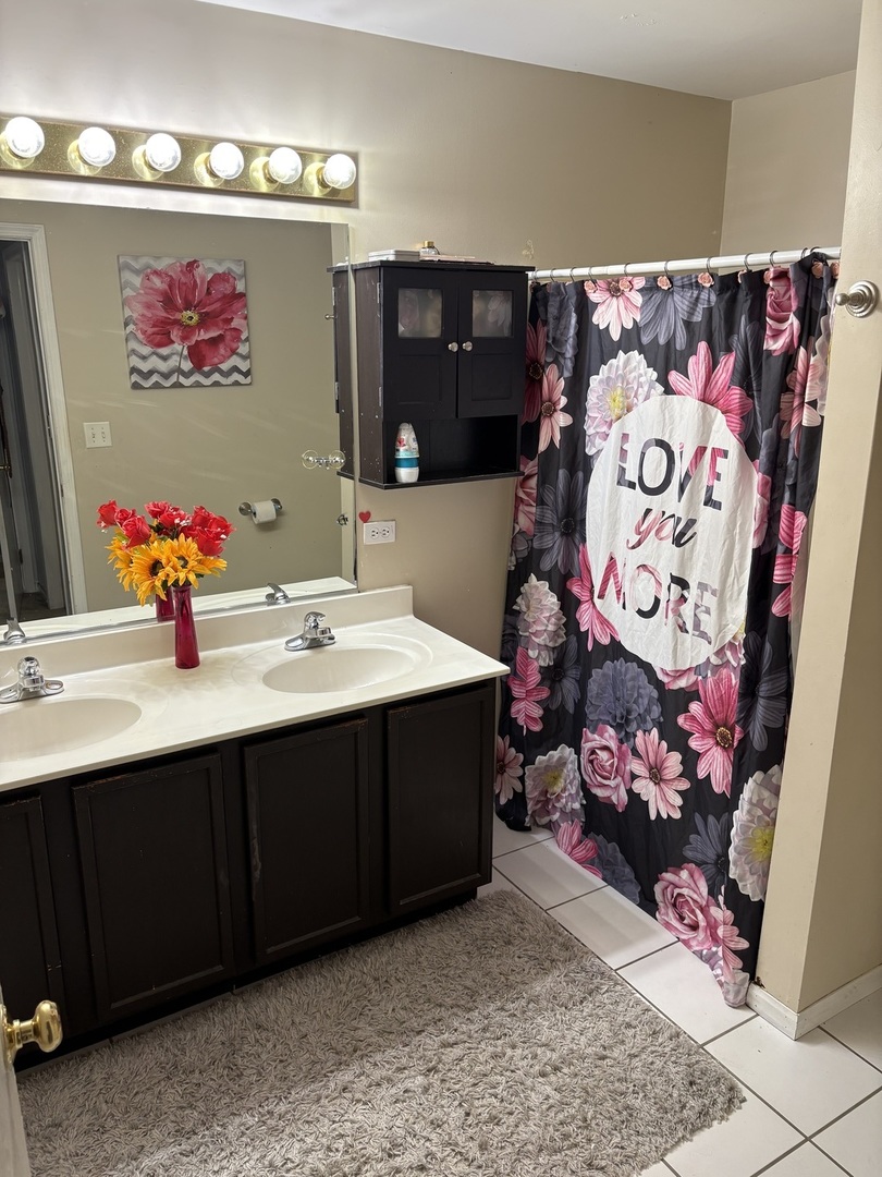 561 Sandy Court Harvard, IL 60033 - Photo 8 of 14 a bathroom with a sink and a mirror