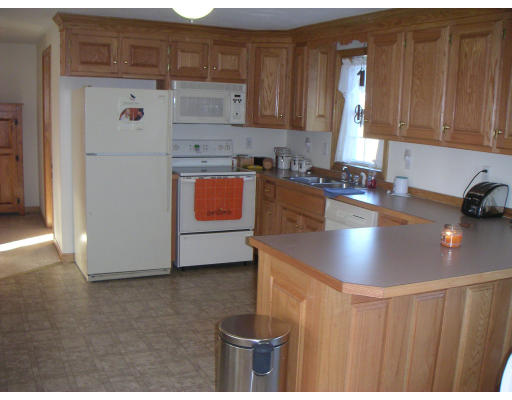 326 S Road Templeton, MA 01468 - Photo 2 of 8 a kitchen with stainless steel appliances granite countertop a sink a stove and a refrigerator