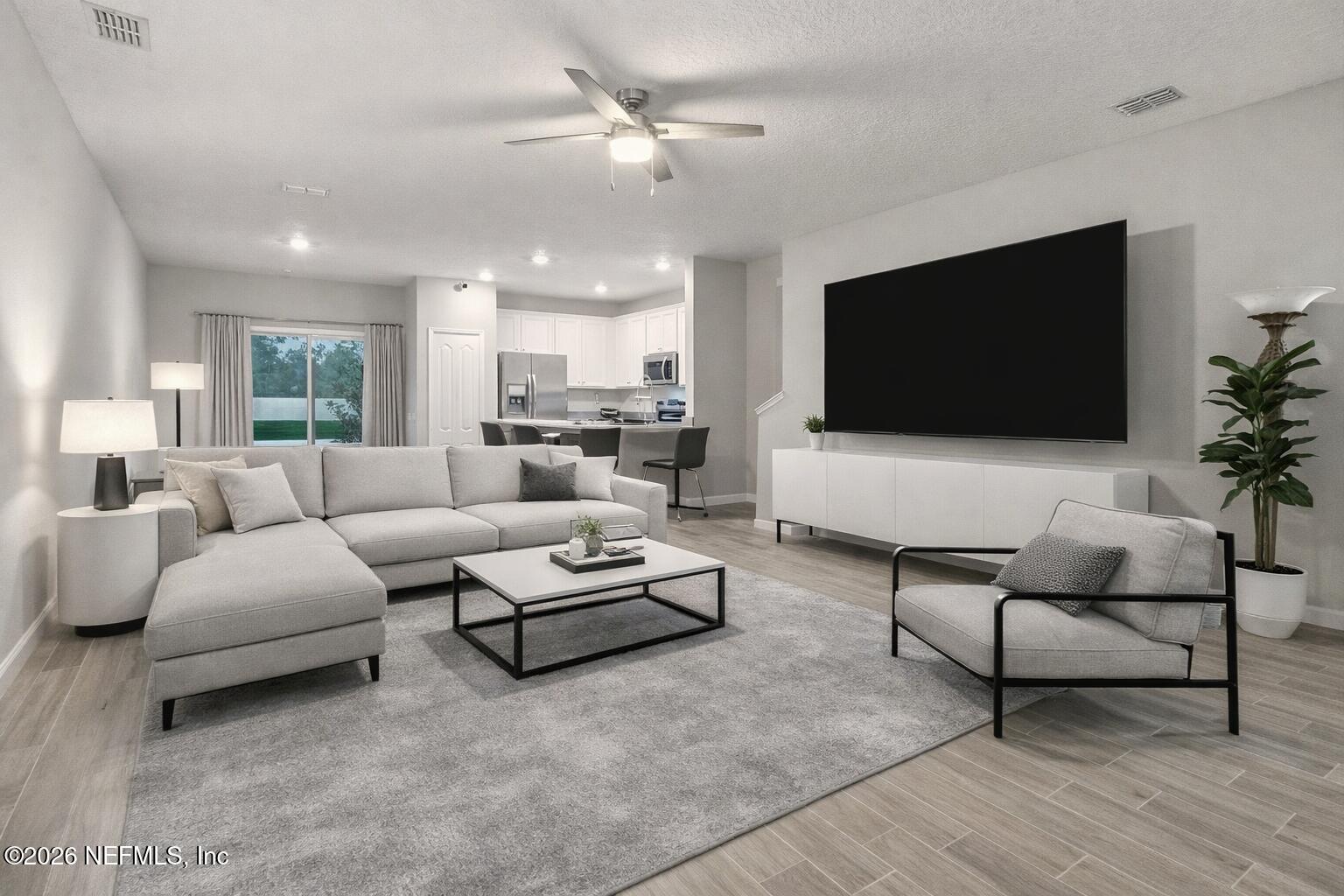 1330 Salt Ridge Avenue Jacksonville, FL 32218 - Photo 1 of 30 a living room with furniture and a flat screen tv