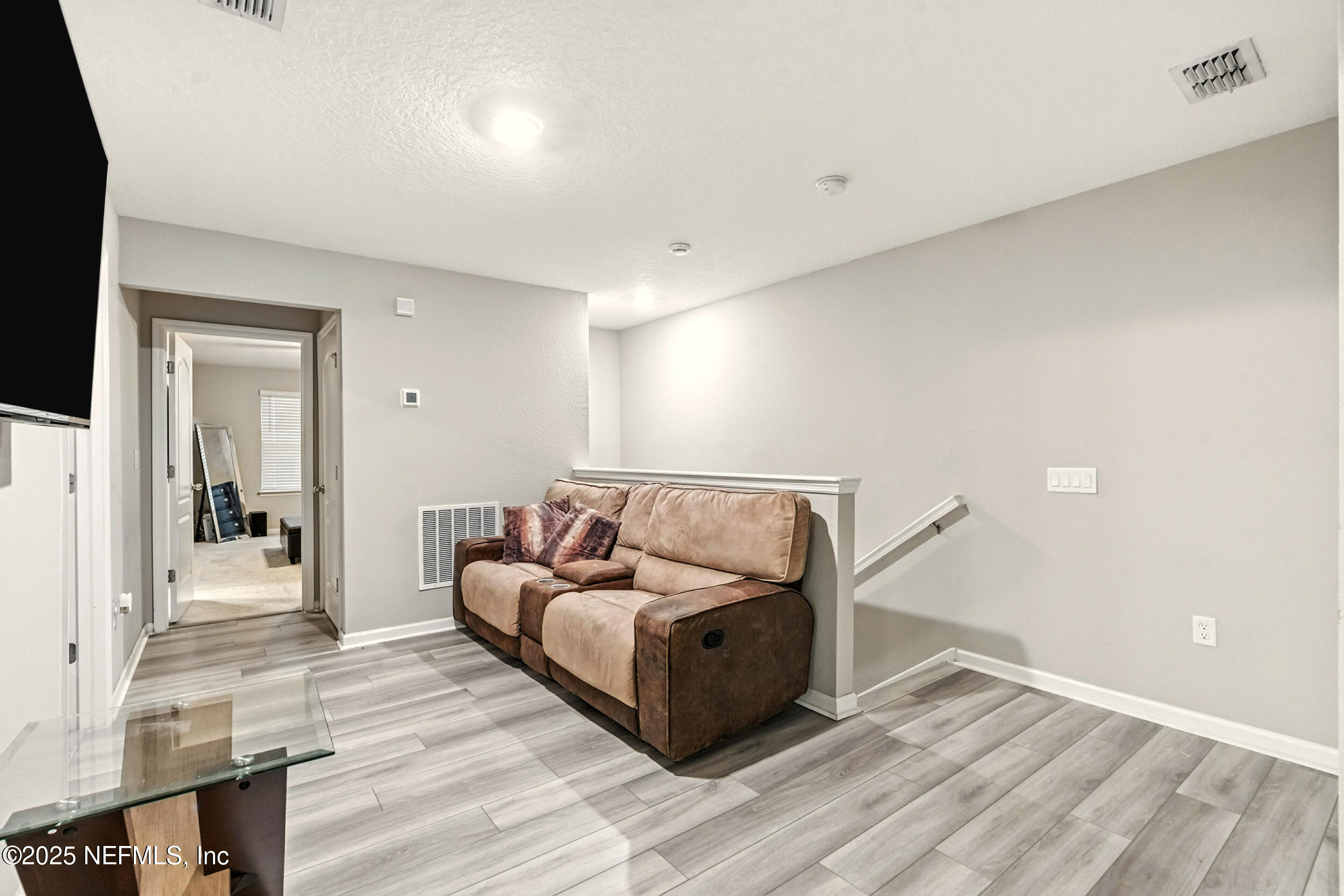 1330 Salt Ridge Avenue Jacksonville, FL 32218 - Photo 17 of 30 a living room with furniture and a wooden floor