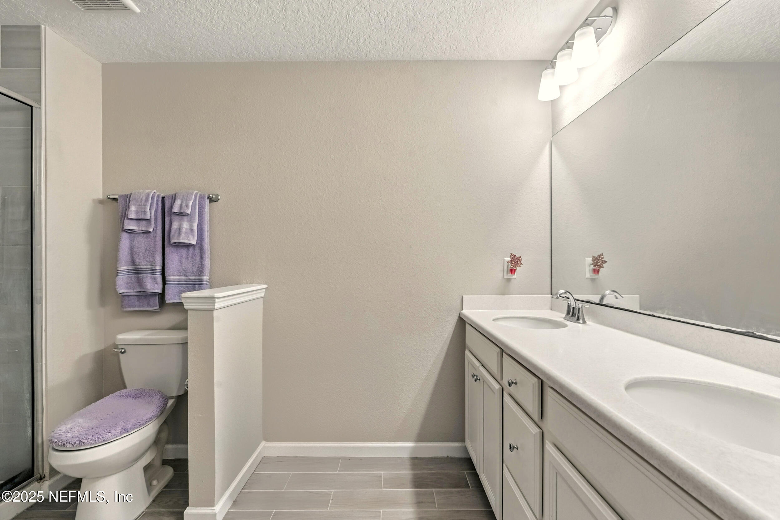 1330 Salt Ridge Avenue Jacksonville, FL 32218 - Photo 18 of 30 a bathroom with a sink and a toilet