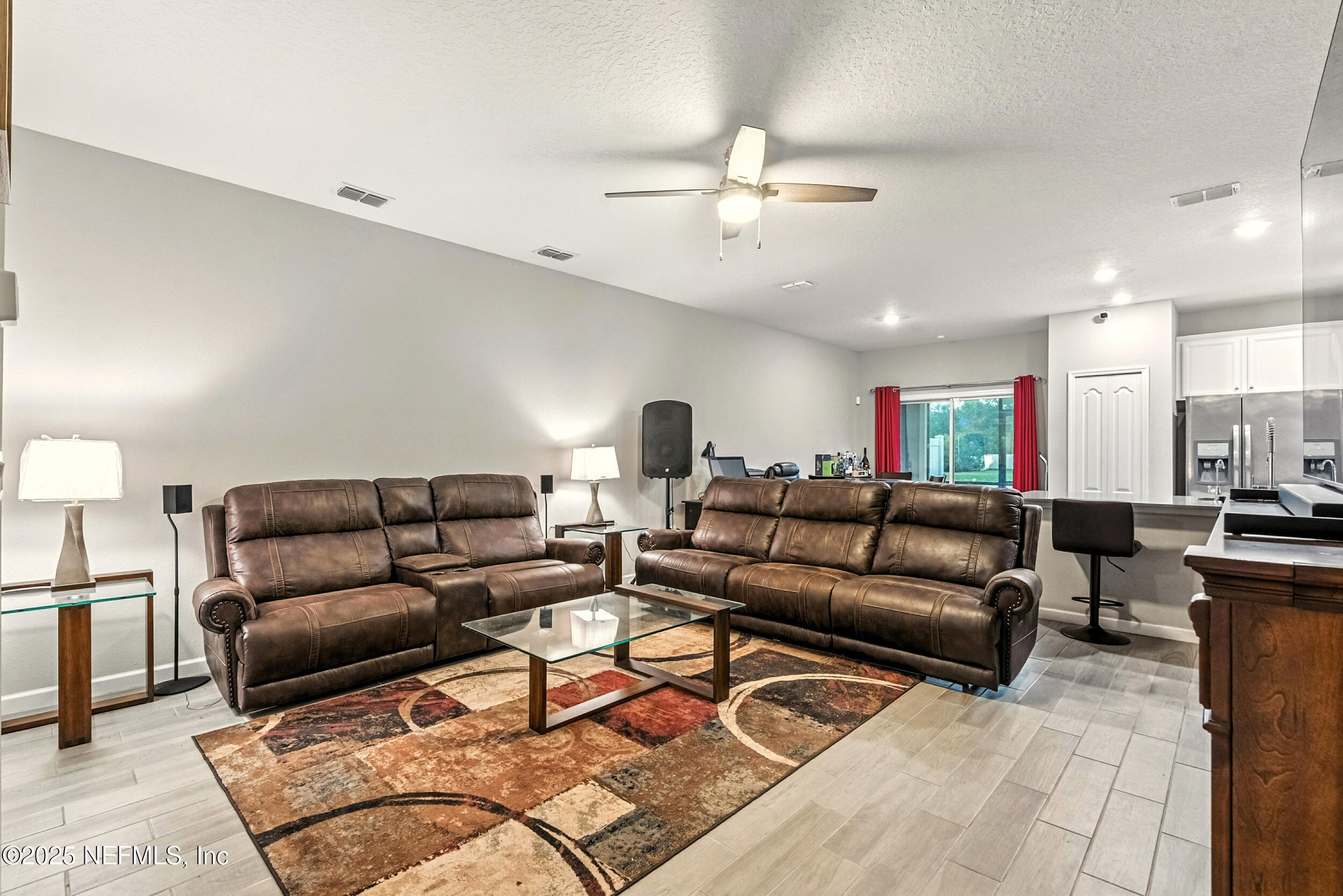 1330 Salt Ridge Avenue Jacksonville, FL 32218 - Photo 5 of 27 a living room with furniture and a view of kitchen