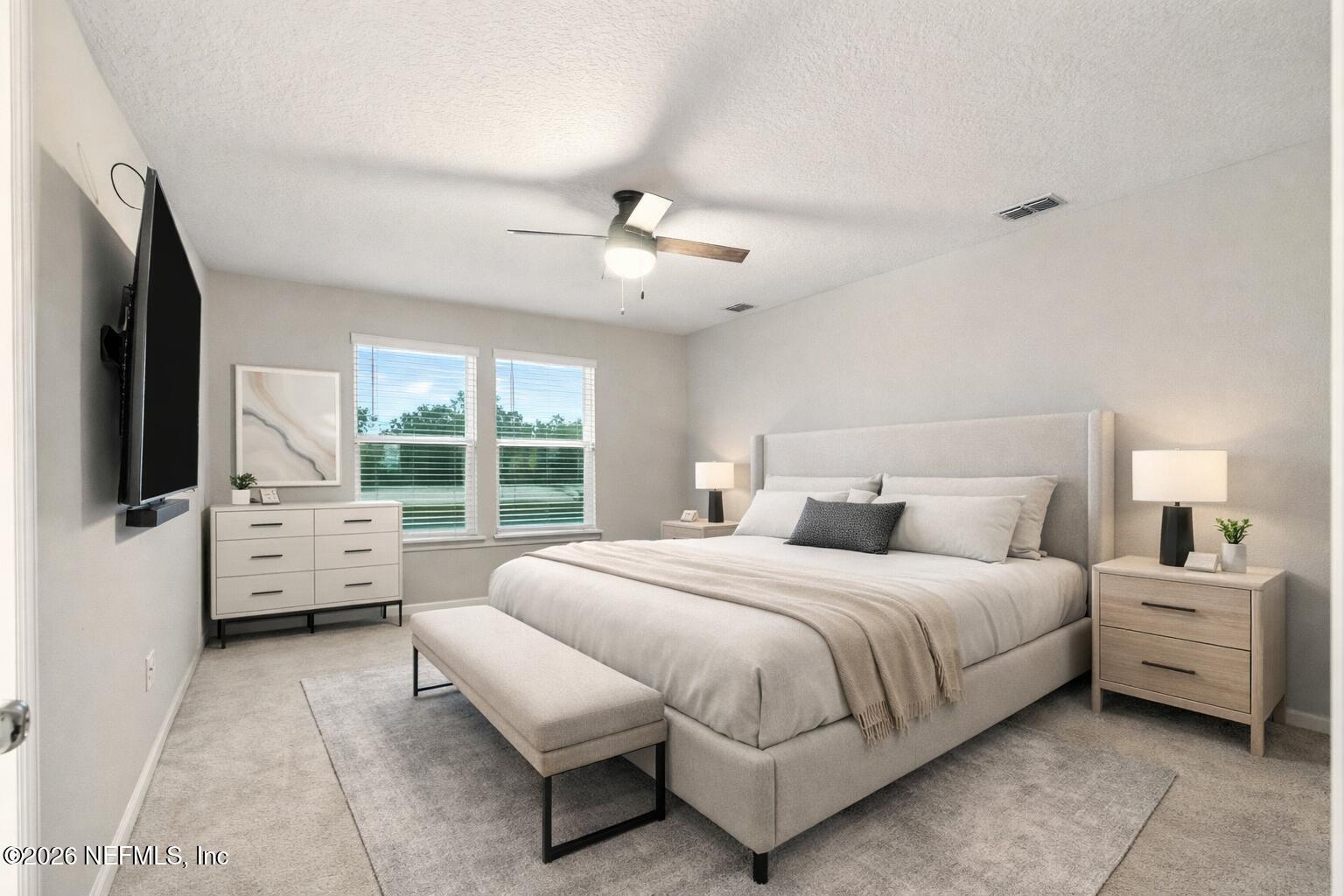1330 Salt Ridge Avenue Jacksonville, FL 32218 - Photo 6 of 30 a bedroom with a bed and a flat screen tv