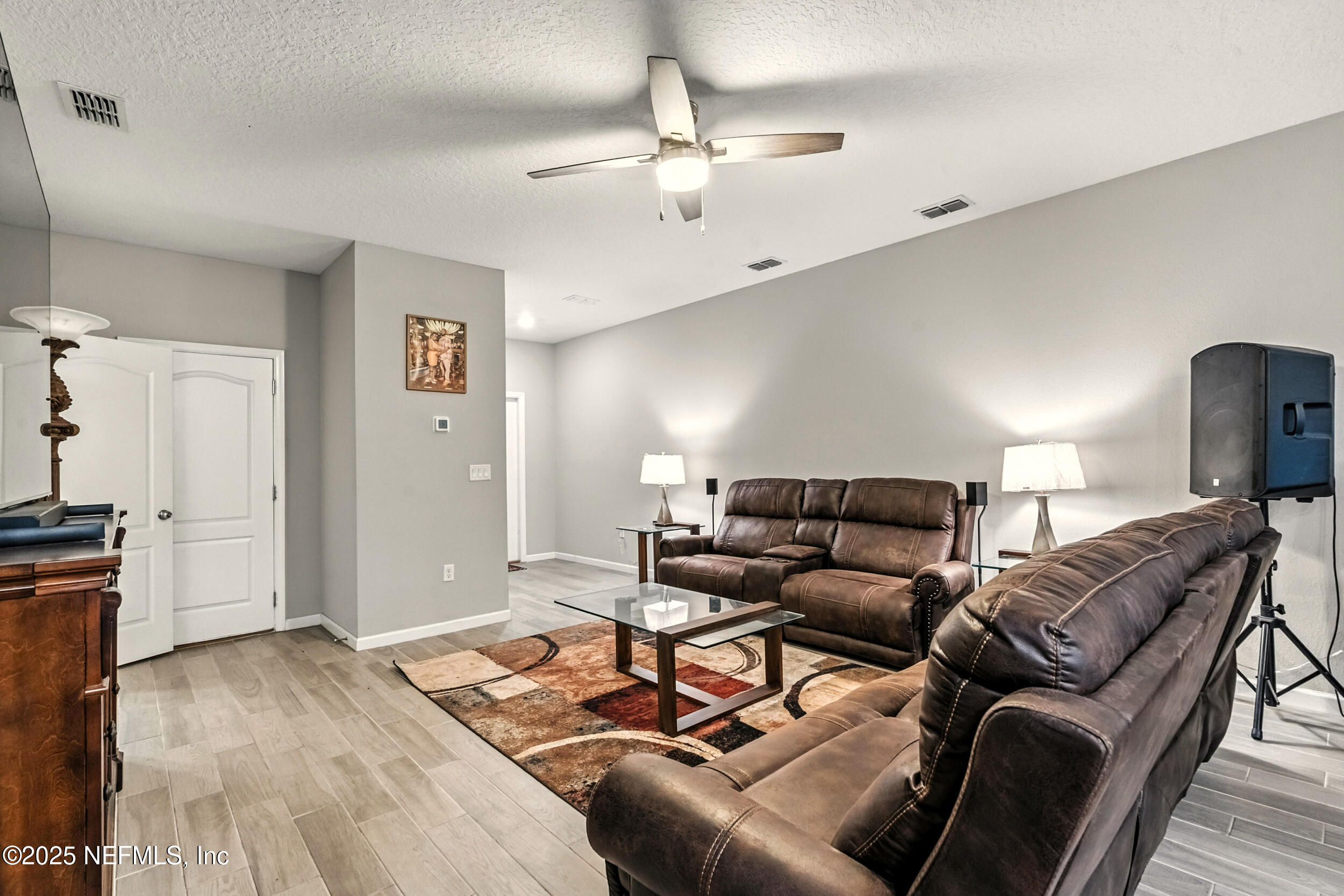 1330 Salt Ridge Avenue Jacksonville, FL 32218 - Photo 6 of 27 a living room with furniture and a wooden floor