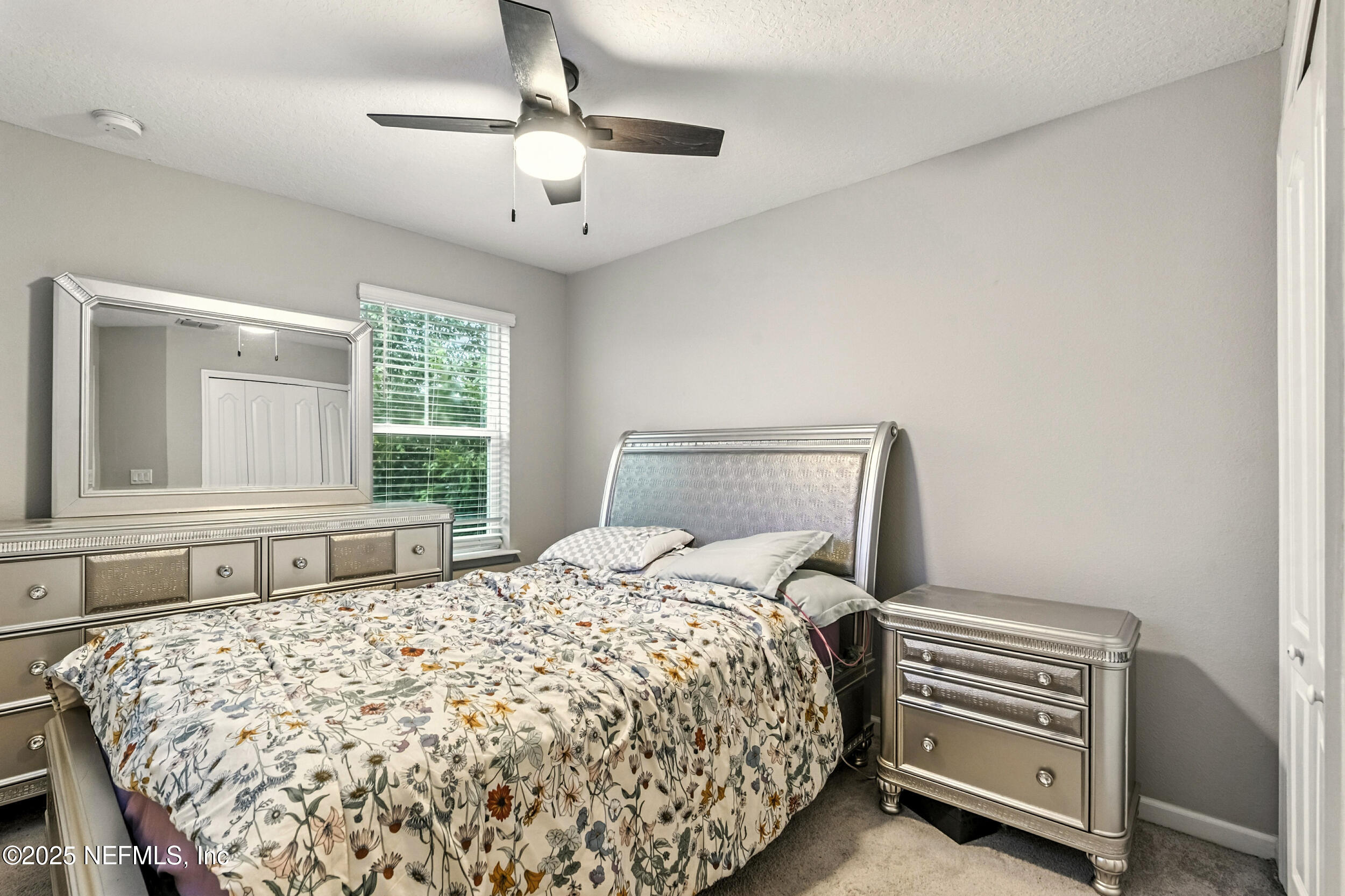 1330 Salt Ridge Avenue Jacksonville, FL 32218 - Photo 10 of 30 a bedroom with a bed and a window