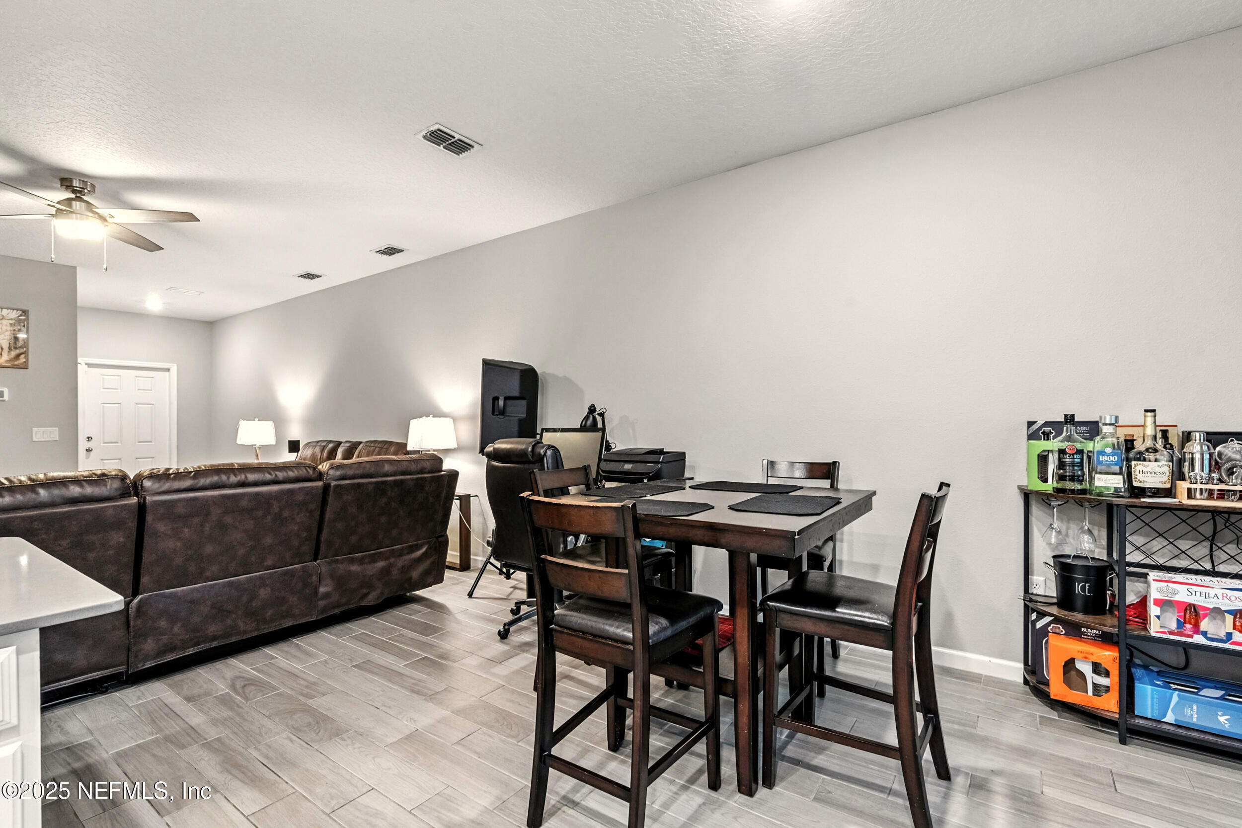 1330 Salt Ridge Avenue Jacksonville, FL 32218 - Photo 10 of 27 a view of a dining room with furniture and a chandelier