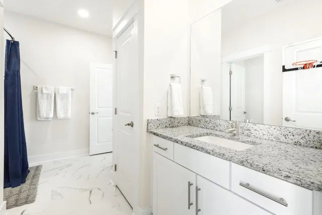 a bathroom with a bathtub and a shower