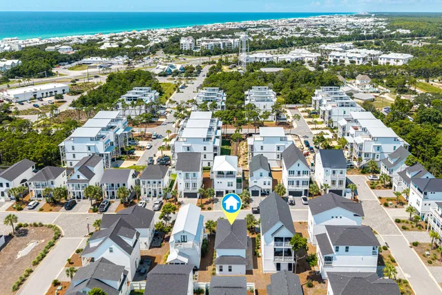 an aerial view of residential houses with outdoor space