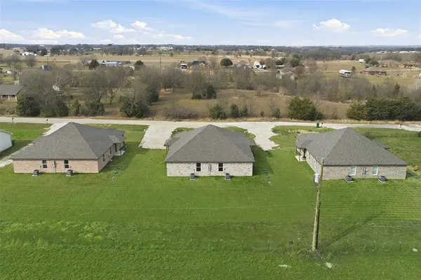 a view of a lake with a yard