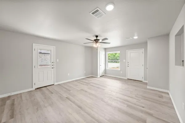 a view of an empty room with a window