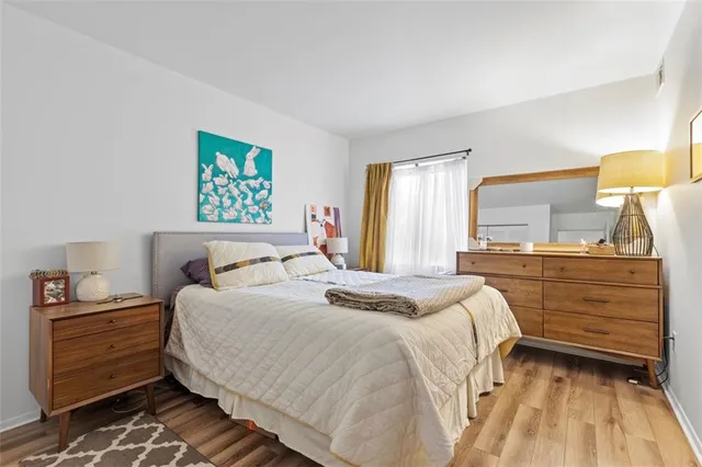 a bedroom with a bed and a dresser