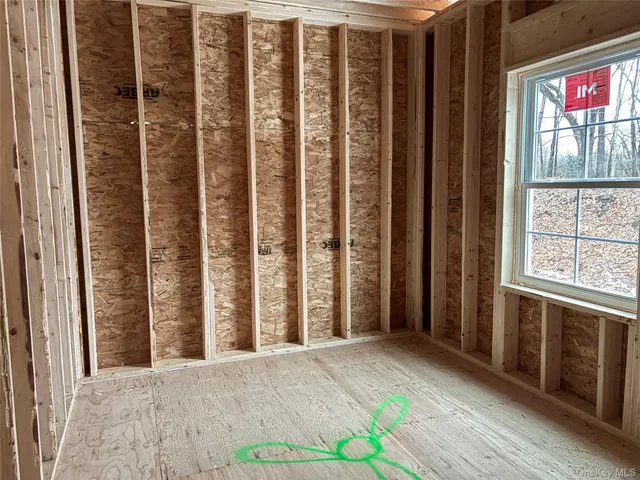 a view of a porch with a table and chairs