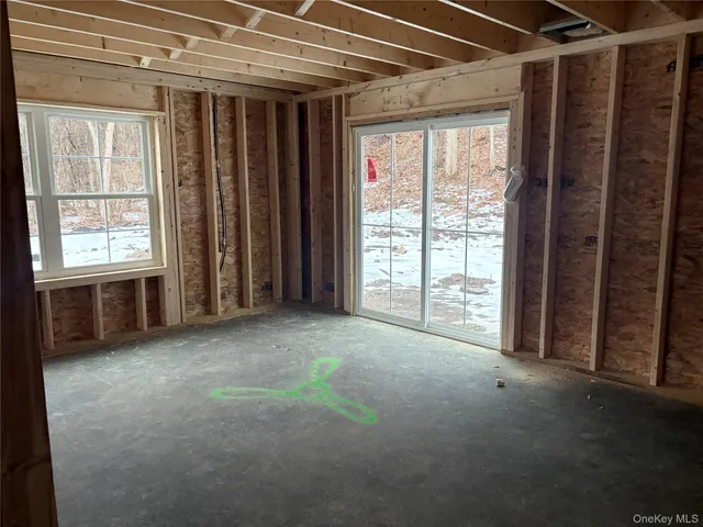 a view of empty room with windows