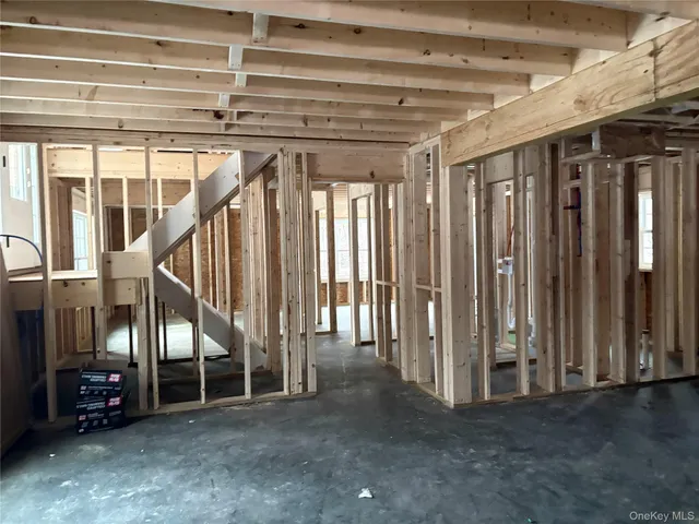a view of an empty room with stairs