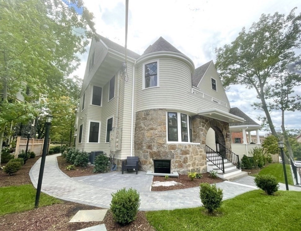 24 Selkirk Road, Unit 244 Boston, MA 02135 - Photo 1 of 31 a front view of a house with yard and green space