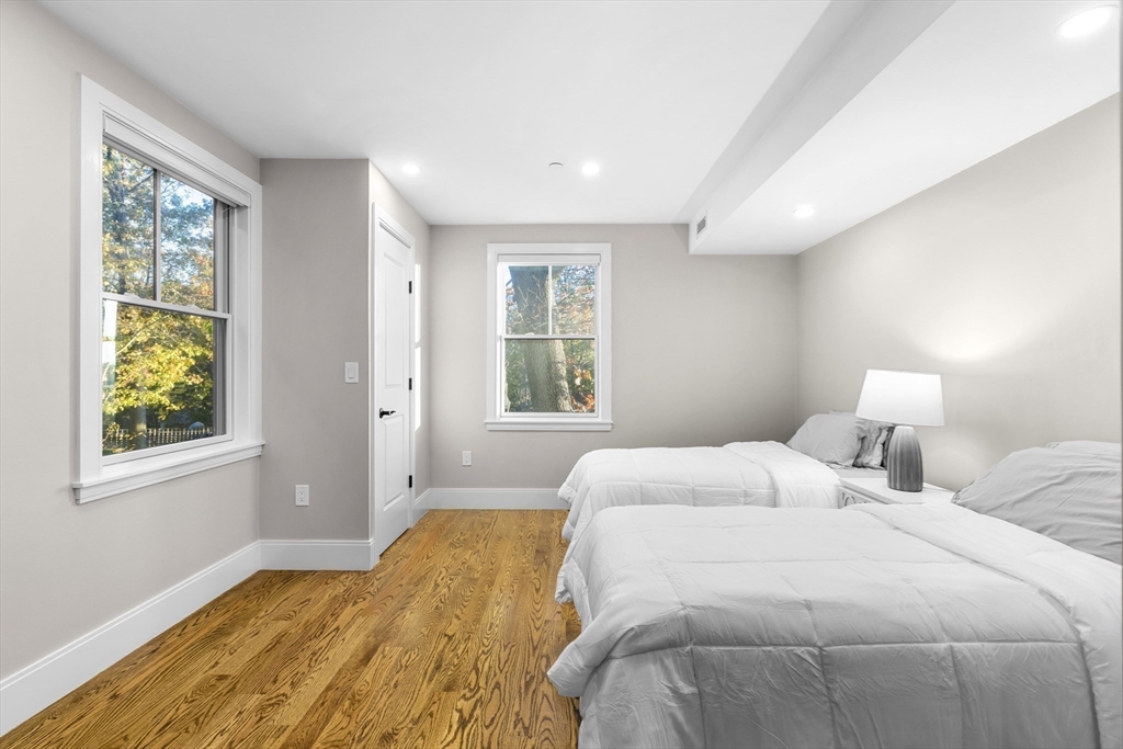 24 Selkirk Road, Unit 244 Boston, MA 02135 - Photo 12 of 31 a bedroom with a bed and a window