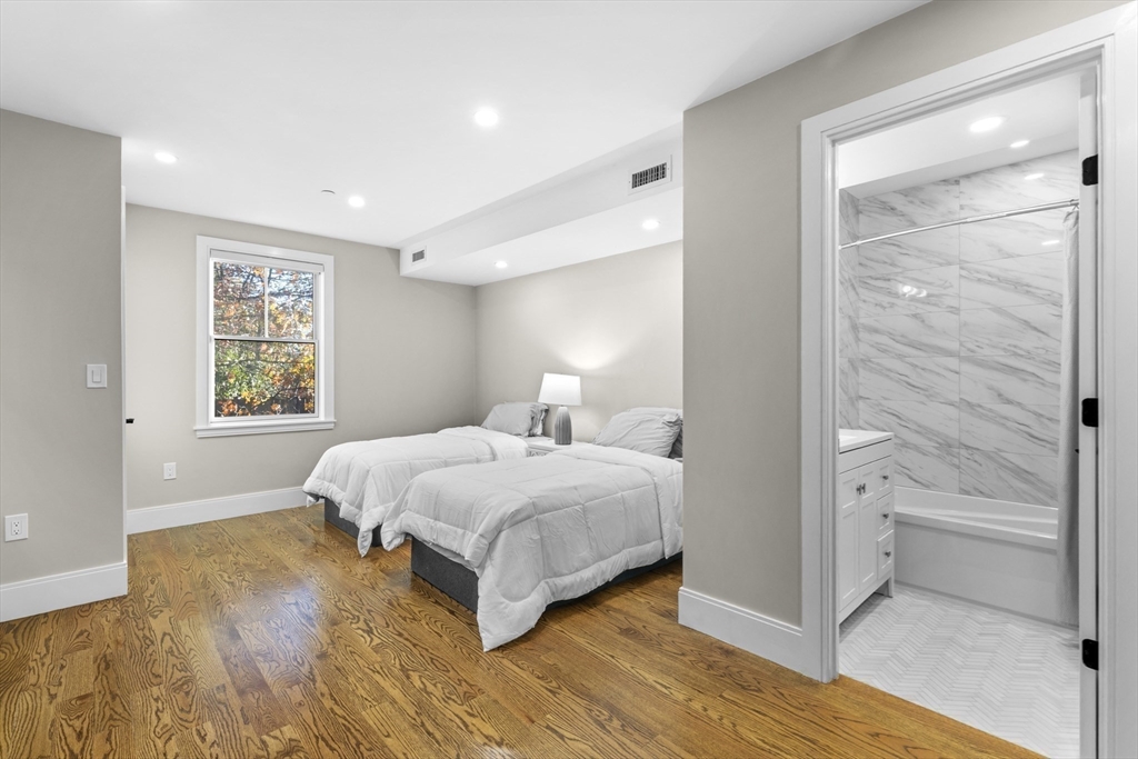 24 Selkirk Road, Unit 244 Boston, MA 02135 - Photo 13 of 31 a bedroom with a bed and a window