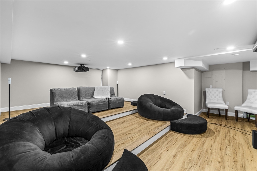 24 Selkirk Road, Unit 244 Boston, MA 02135 - Photo 22 of 31 a room with furniture and a wooden floor
