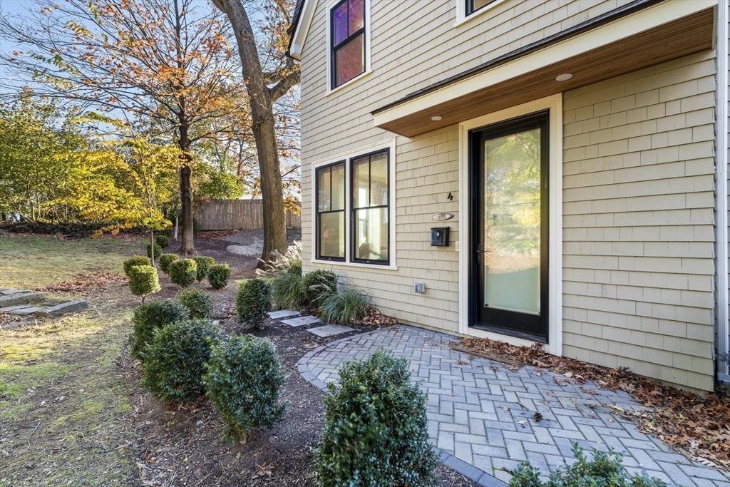 24 Selkirk Road, Unit 244 Boston, MA 02135 - Photo 26 of 31 a front view of a house with garden