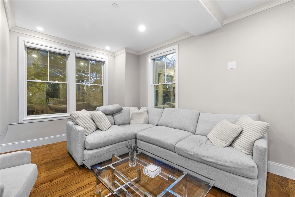 24 Selkirk Road, Unit 244 Boston, MA 02135 - Photo 8 of 31 a living room with furniture and a large window