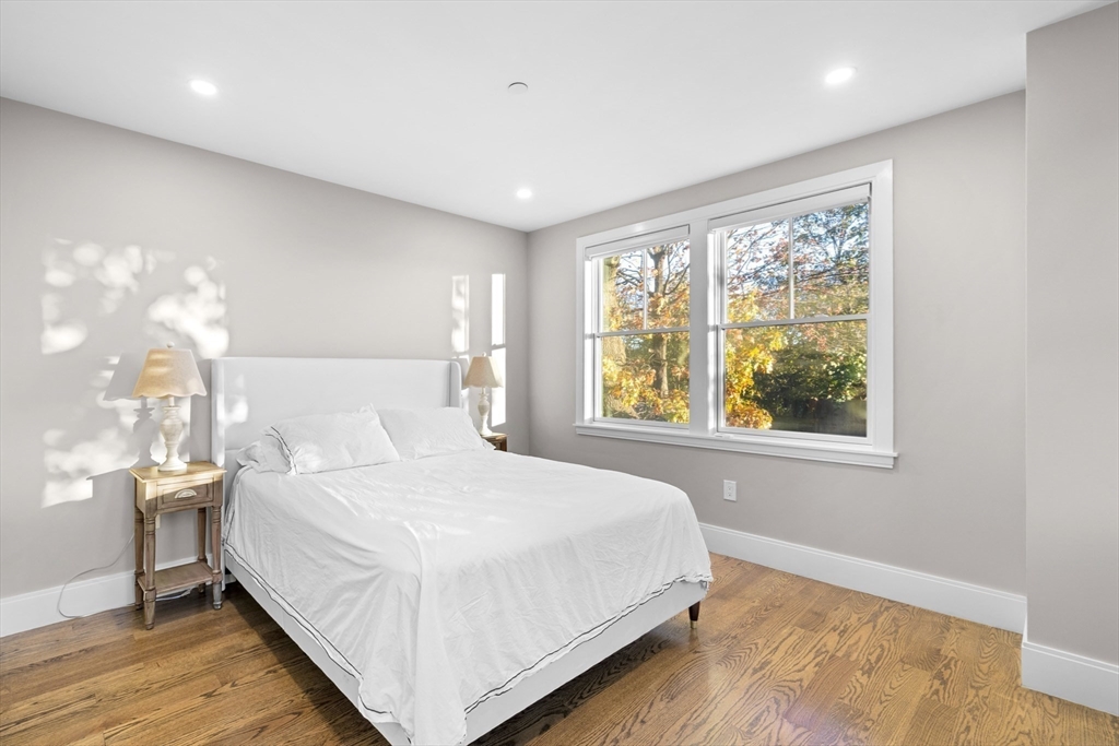 24 Selkirk Road, Unit 244 Boston, MA 02135 - Photo 9 of 31 a bedroom with a large bed and a window