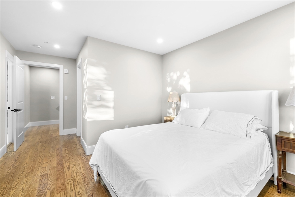 24 Selkirk Road, Unit 244 Boston, MA 02135 - Photo 10 of 31 a bedroom with a bed and a large window