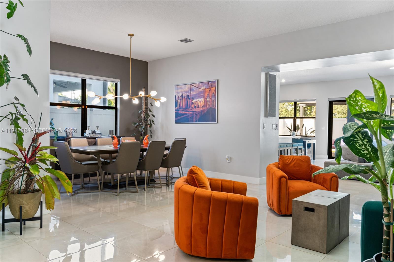 17375 Southwest 41st Street Miramar, FL 33029 - Photo 11 of 53 a living room with furniture a potted plant and a large window