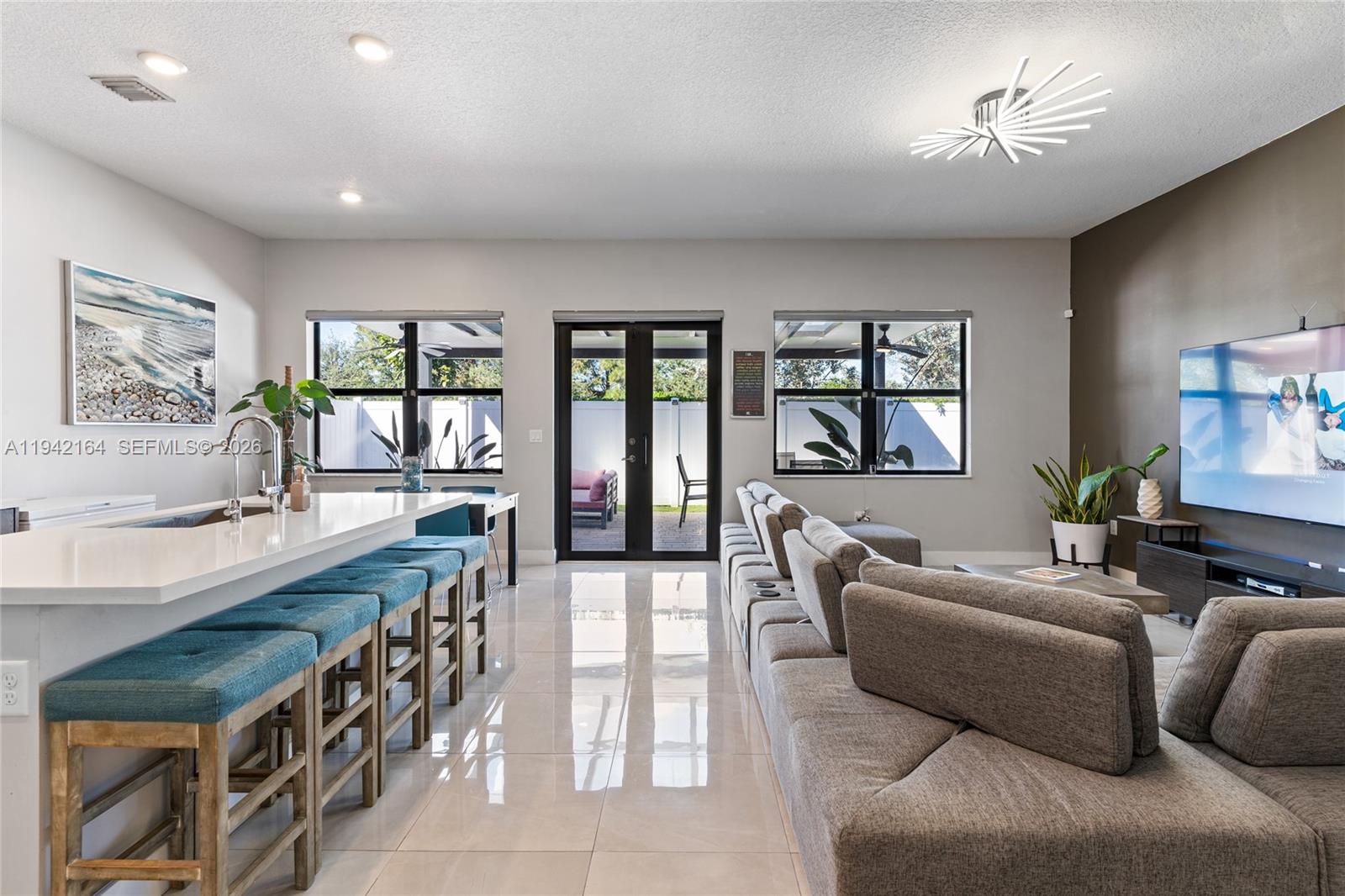 17375 Southwest 41st Street Miramar, FL 33029 - Photo 15 of 53 a living room with furniture and a large window