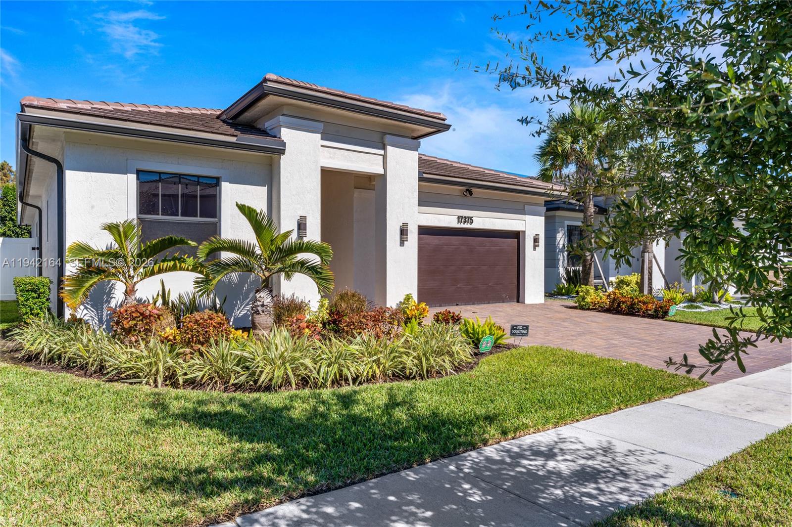 17375 Southwest 41st Street Miramar, FL 33029 - Photo 2 of 53 a front view of a house with a yard