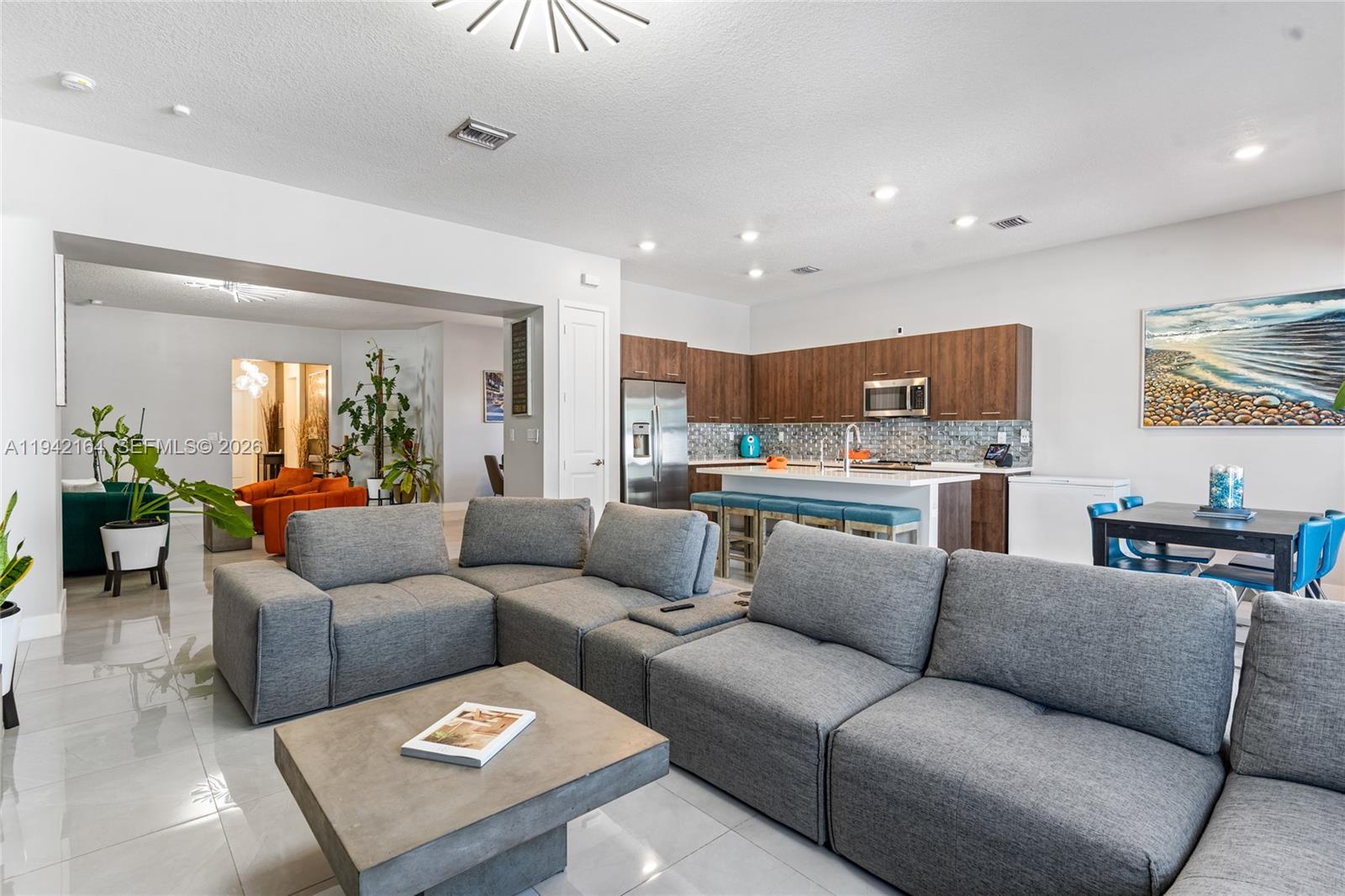 17375 Southwest 41st Street Miramar, FL 33029 - Photo 22 of 53 a living room with furniture and kitchen view