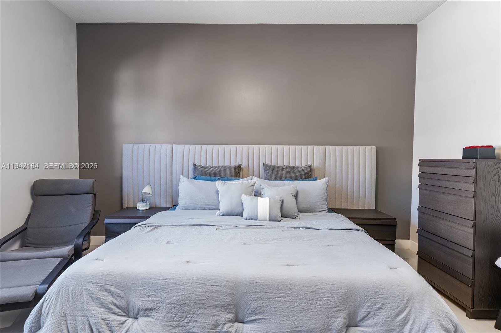 17375 Southwest 41st Street Miramar, FL 33029 - Photo 27 of 53 a bedroom with a bed and with chair