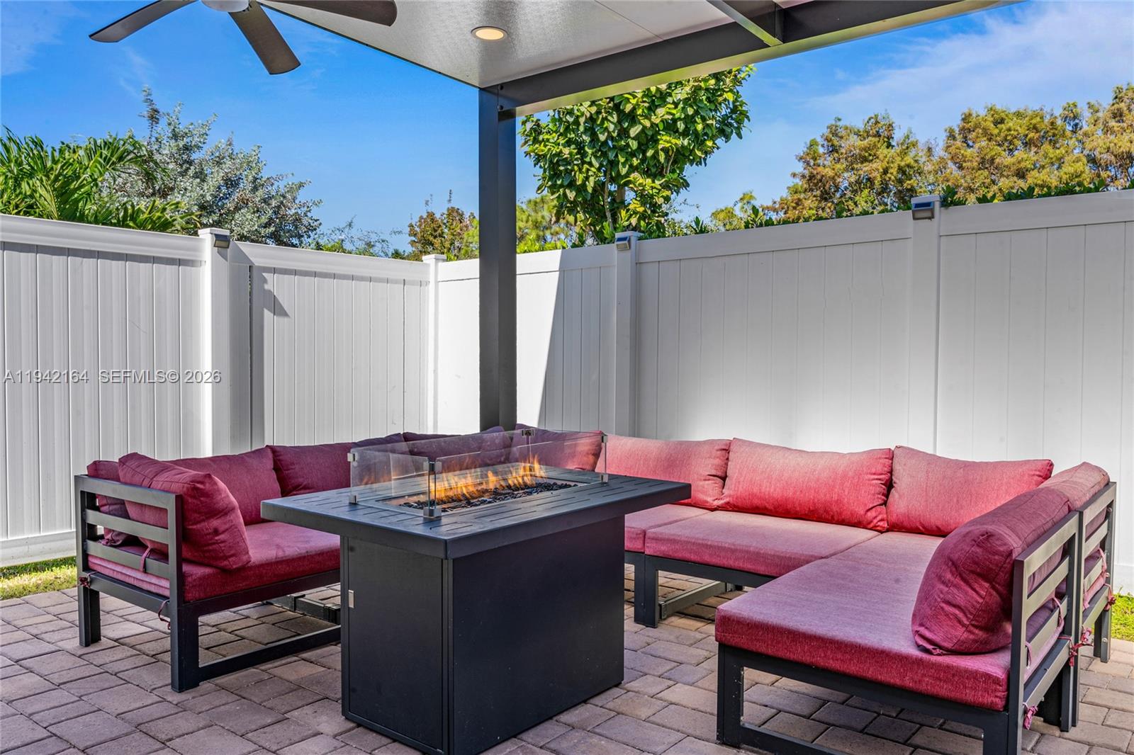 17375 Southwest 41st Street Miramar, FL 33029 - Photo 37 of 53 a outdoor sitting area with a couch and potted plants
