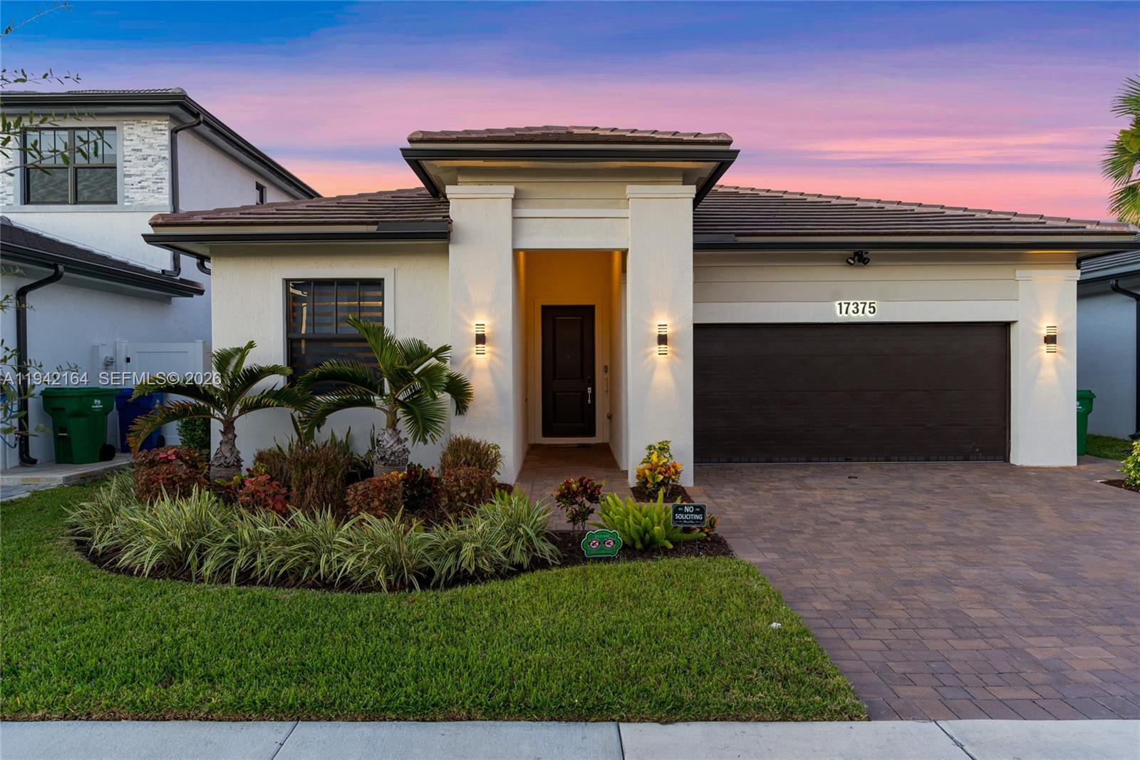 17375 Southwest 41st Street Miramar, FL 33029 - Photo 41 of 53 a front view of a house with a yard