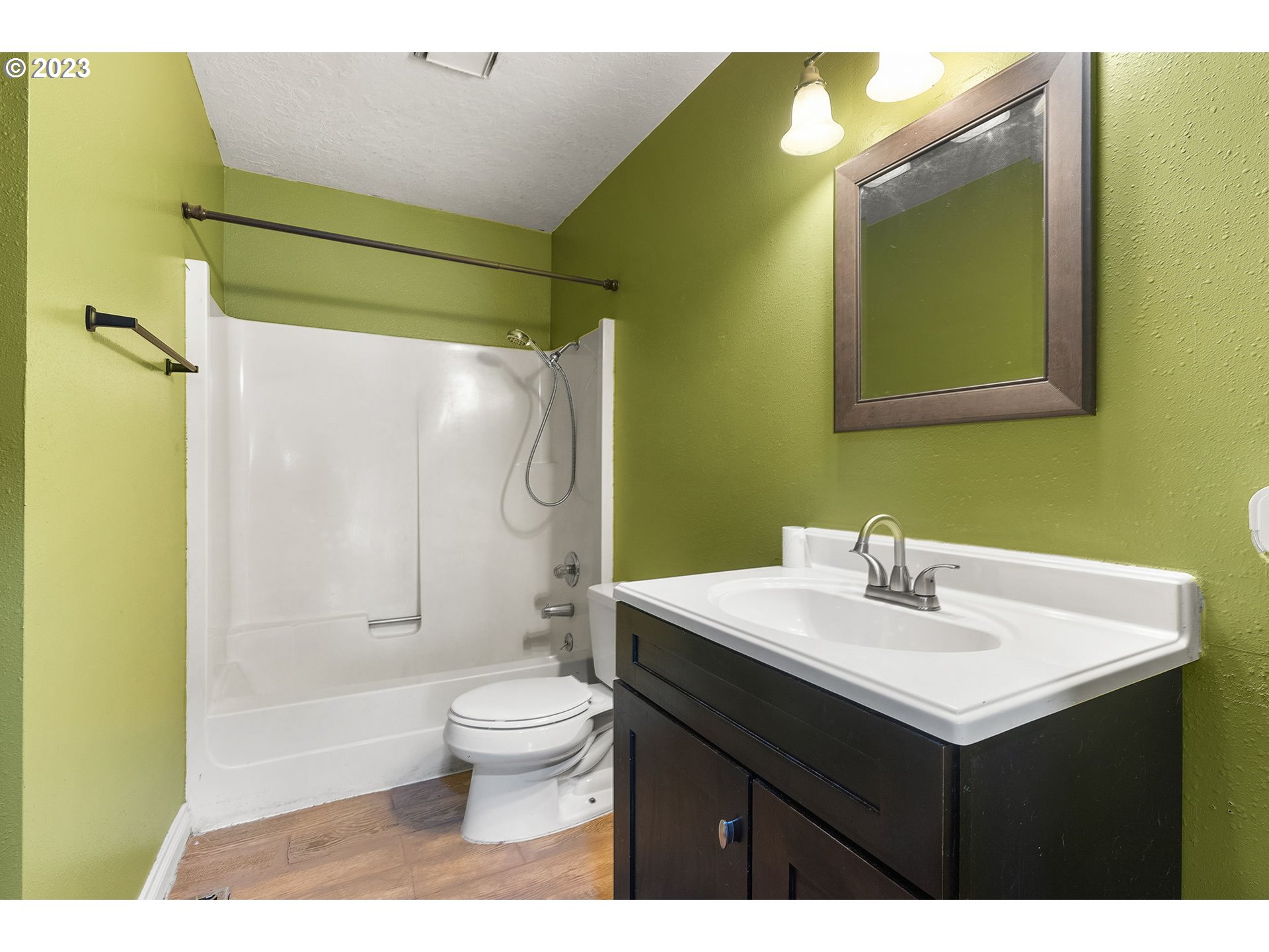2720 Southeast Palmquist Road Gresham, OR 97080 - Photo 12 of 15 a bathroom with a sink mirror toilet and shower