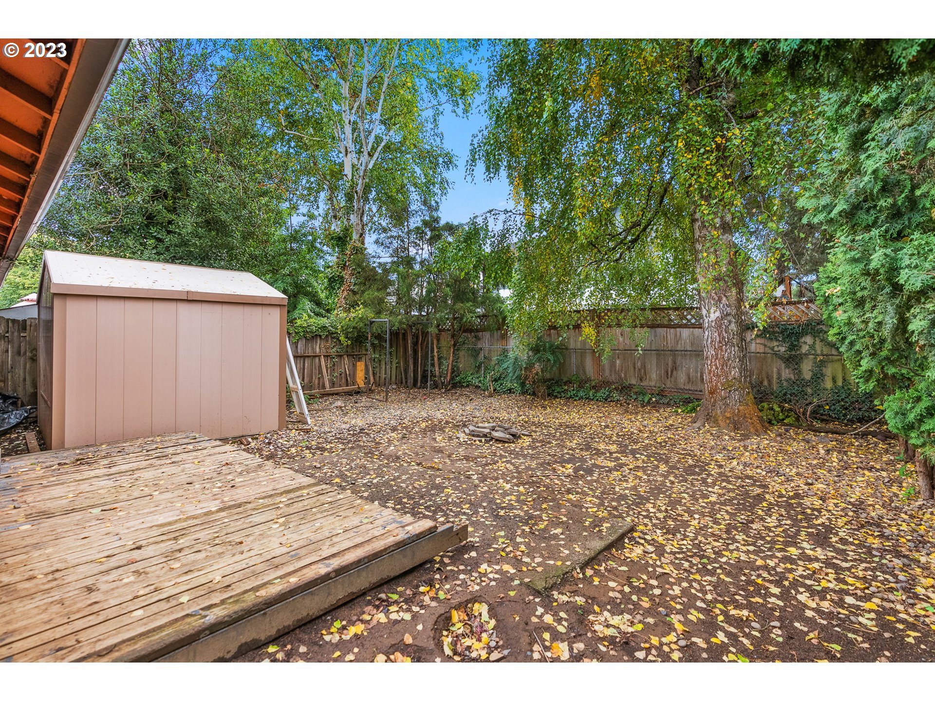 2720 Southeast Palmquist Road Gresham, OR 97080 - Photo 13 of 15 a backyard of a house with lots of green space