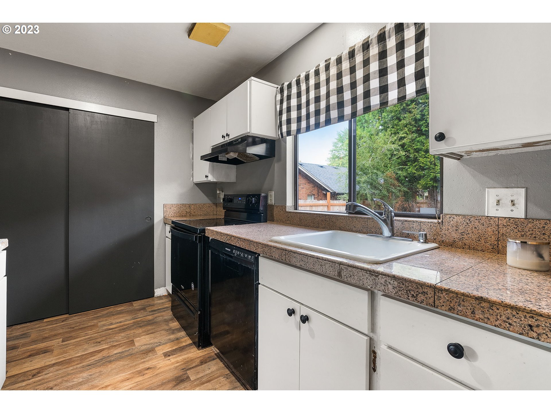 2720 Southeast Palmquist Road Gresham, OR 97080 - Photo 3 of 15 a kitchen with a sink and cabinets