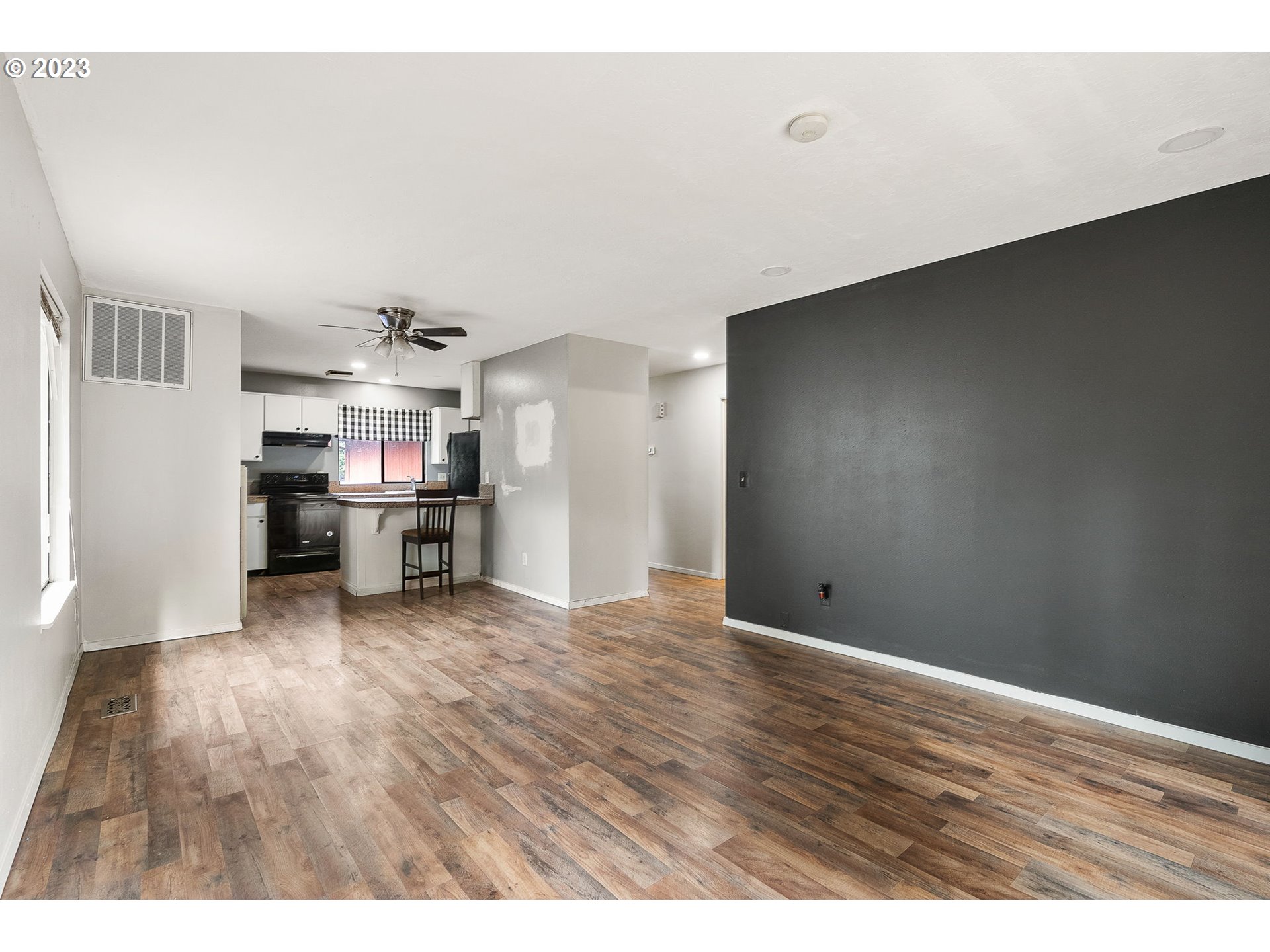 2720 Southeast Palmquist Road Gresham, OR 97080 - Photo 5 of 15 a view of empty room with wooden floor