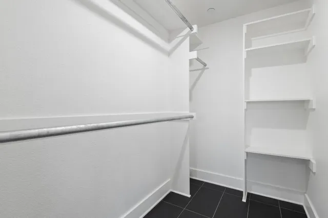 a view of storage and utility room with closet