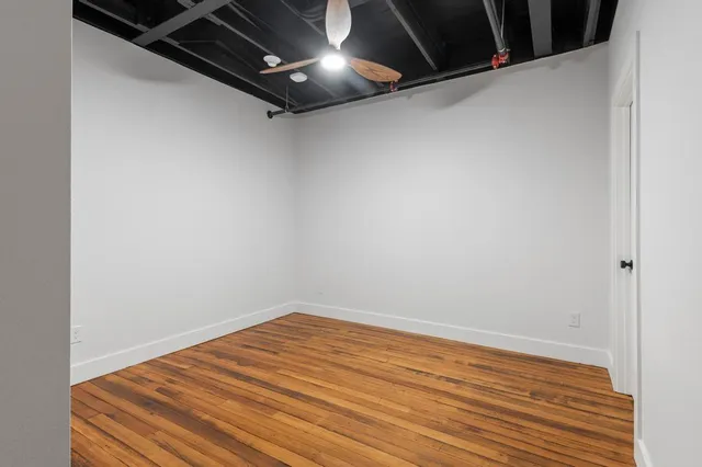 a view of a balcony with wooden floor